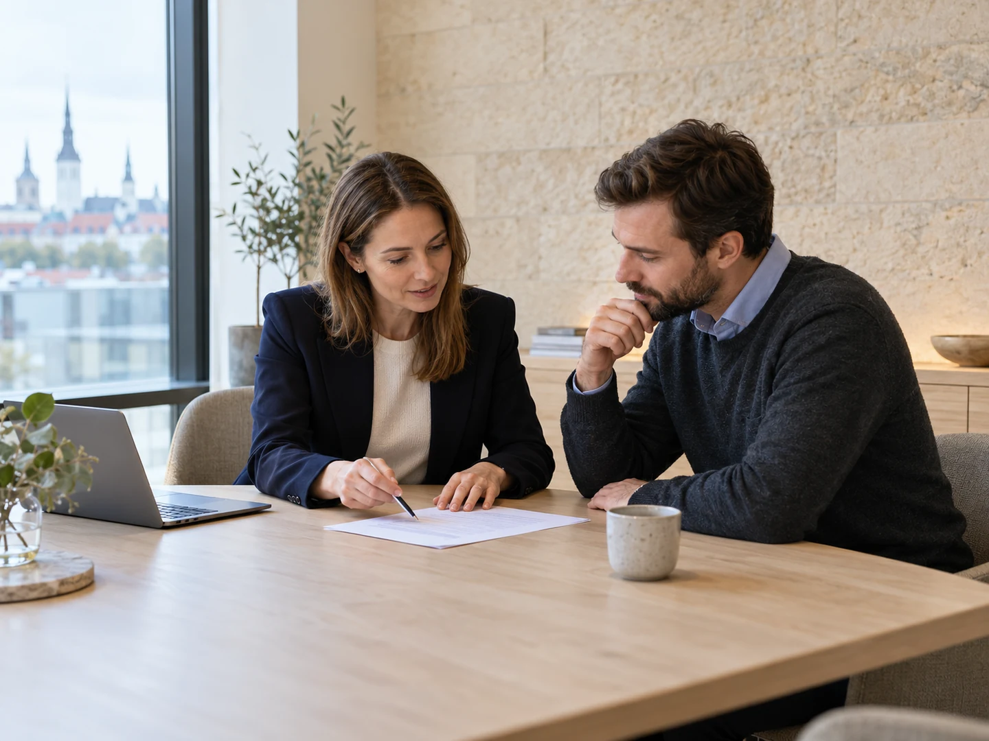 Professionals reviewing a service brief around a meeting table
